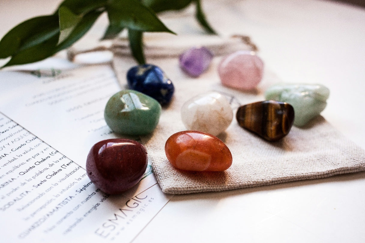 A beautiful collection of healing crystals and stones being arranged for chakra balancing and energy alignment