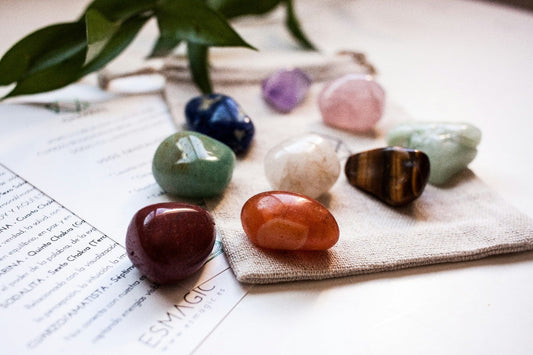 A beautiful collection of healing crystals and stones being arranged for chakra balancing and energy alignment